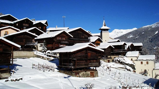 Zoek geweldige sneeuw en een mooi dorp in Grimentz
